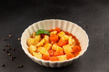 Stewed potatoes with carrots vegetarian side dish fresh delicious gourmet food background on the table rustic food top view copy space keto and paleo diet vegan food