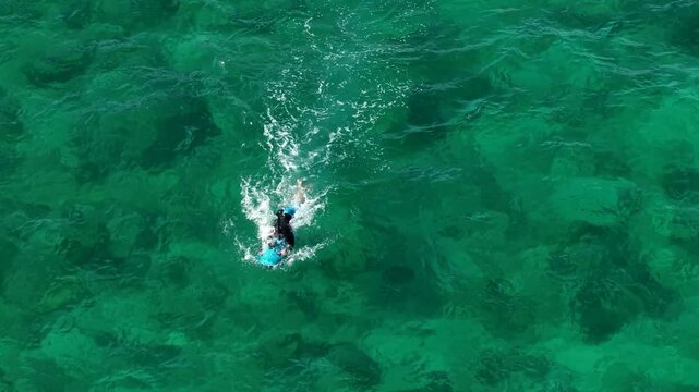 Riding an underwater scooter. Riding in the sea on a modern tugboat. Modern means of entertainment during a yacht vacation. View from a drone