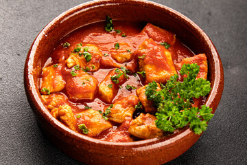 Butter chicken curry poultry meat tomato sauce dish fresh tasty gourmet food background on the table rustic food top view copy space