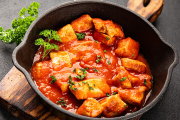 Butter chicken curry poultry meat tomato sauce dish fresh tasty gourmet food background on the table rustic food top view copy space