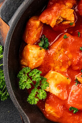 Butter chicken curry poultry meat tomato sauce dish fresh tasty gourmet food background on the table rustic food top view copy space
