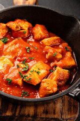 Butter chicken curry poultry meat tomato sauce dish fresh tasty gourmet food background on the table rustic food top view copy space