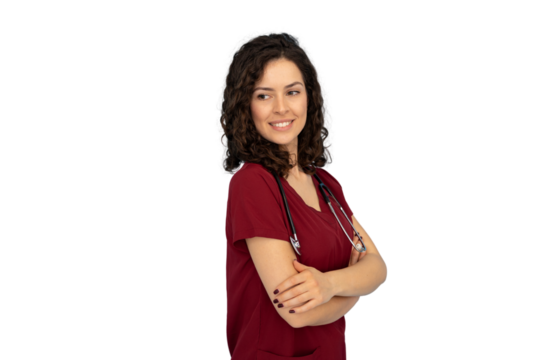 Professional female physician in maroon scrubs, stethoscope draped, confidently posing with crossed arms, gazing aside on isolated background