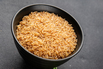 Brown rice whole grain cereal healthy product superfood fresh tasty gourmet food background on the table rustic food top view copy space keto and paleo diet vegetarian and vegan food