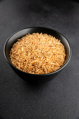 Brown rice whole grain cereal healthy product superfood fresh tasty gourmet food background on the table rustic food top view copy space keto and paleo diet vegetarian and vegan food