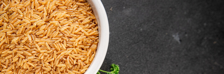 Brown rice whole grain cereal healthy product superfood fresh tasty gourmet food background on the table rustic food top view copy space keto and paleo diet vegetarian and vegan food