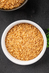 Brown rice whole grain cereal healthy product superfood fresh tasty gourmet food background on the table rustic food top view copy space keto and paleo diet vegetarian and vegan food