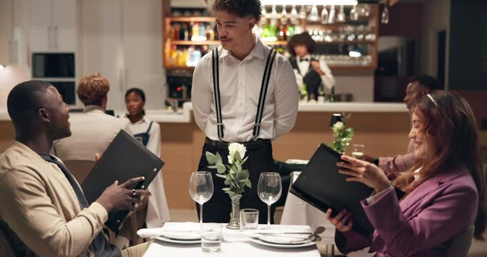 Waiter, menu and couple in restaurant, talking and order for food, culinary cuisine and options. People, employee or decision with conversation, fine dining and service with hospitality and server