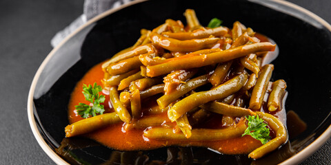 Green beans tomato sauce fresh delicious gourmet food background on the table rustic food top view copy space keto and paleo diet vegetarian and vegan food
