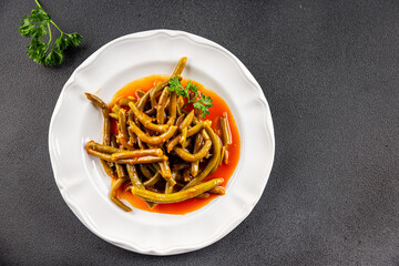 Green beans tomato sauce fresh delicious gourmet food background on the table rustic food top view copy space keto and paleo diet vegetarian and vegan food