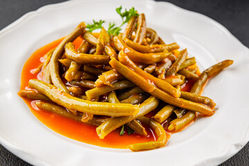 Green beans tomato sauce fresh delicious gourmet food background on the table rustic food top view copy space keto and paleo diet vegetarian and vegan food