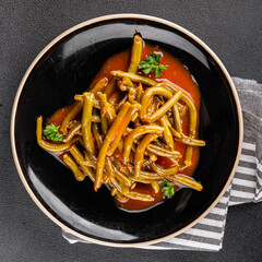 Green beans tomato sauce fresh delicious gourmet food background on the table rustic food top view copy space keto and paleo diet vegetarian and vegan food