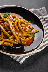 Green beans tomato sauce fresh delicious gourmet food background on the table rustic food top view copy space keto and paleo diet vegetarian and vegan food