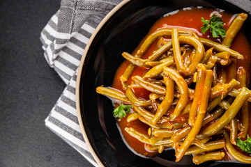 Green beans tomato sauce fresh delicious gourmet food background on the table rustic food top view copy space keto and paleo diet vegetarian and vegan food