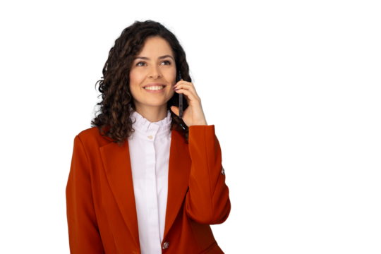 Happy businesswoman wearing an orange blazer is speaking on her smartphone, looking away and smiling, on a transparent background