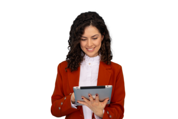 Smiling professional with curly hair wearing red blazer, working on digital tablet against transparent backdrop