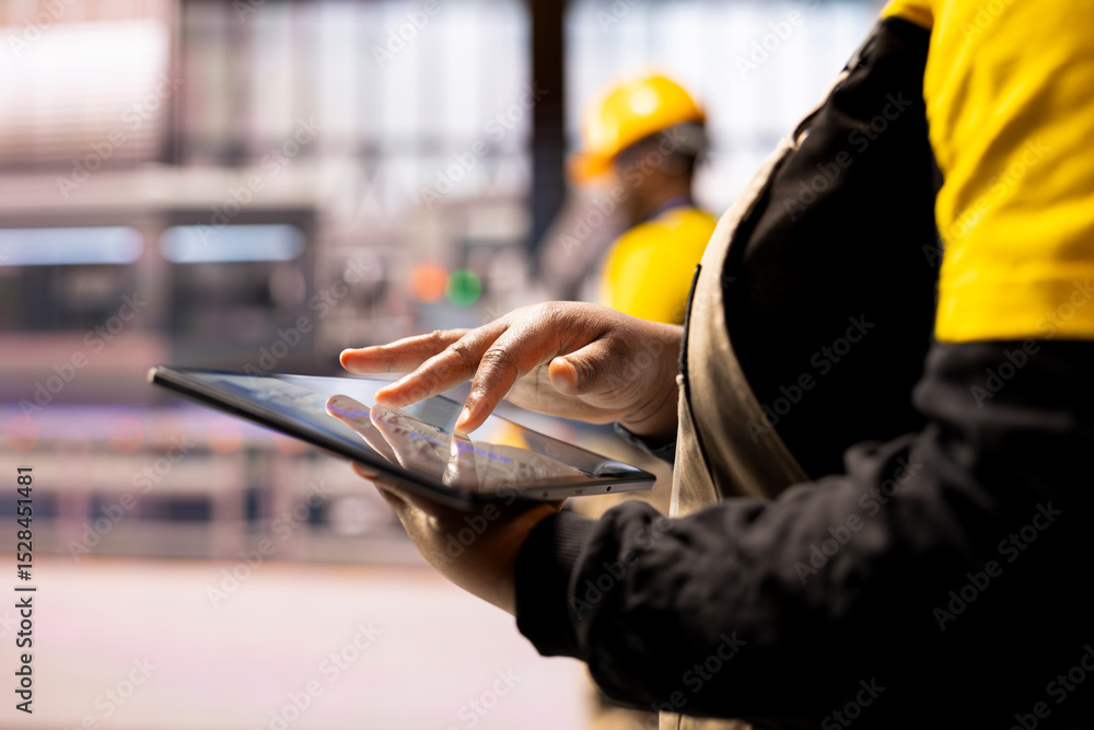 Poster closeup of professional using tablet in high tech factory, symbolizing industry 4.0, digital automat