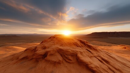 Naklejka premium A breathtaking view of a majestic sunset paints the sky in vibrant colors above a rugged mountain landscape, evoking feelings of awe and a connection to nature's beauty.