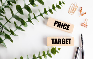 Price target text on wooden blocks with pens, eucalyptus and stationery on white background