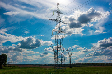 High voltage power line with supports against clouds