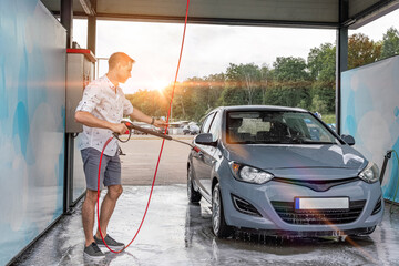 Car wash background. Car washing station foam. Man self service detail splash.
