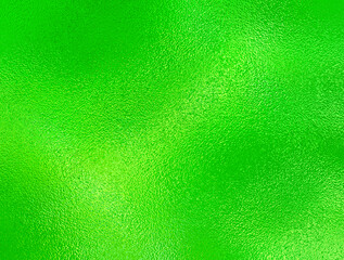 Soft Green foil glass texture background. Abstract gradient bright light reflection and shiny rough texture surface. Glass effect background
