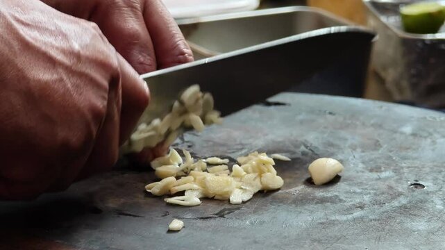 Chop the garlic on a cutting board.