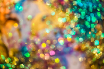 Warm glittering lights form a soft bokeh background with cheerful, festive sparkle and radiant glowing tones