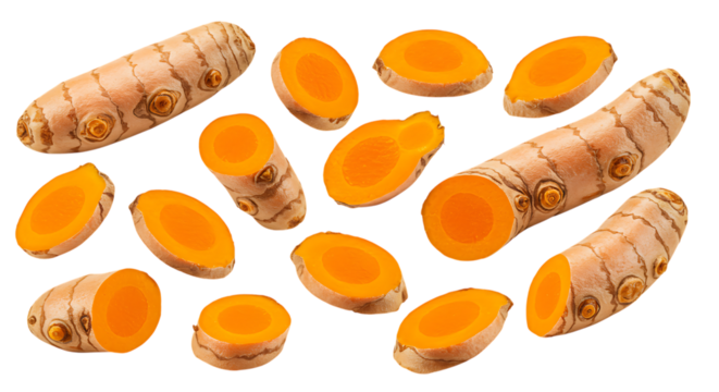 Fresh turmeric root slices and whole pieces isolated on white background