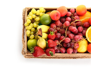 Wooden box with different fresh fruits on white background