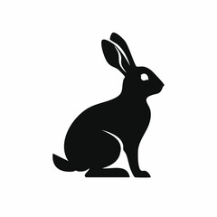 Obraz premium Silhouette of a sitting rabbit in black against a white background in vector form