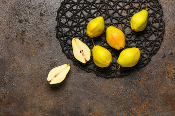 Many fresh pears on dark background
