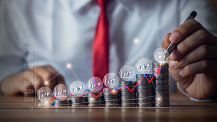 Businessman putting down money, pointing with pen and showing candlestick symbol for investing,...