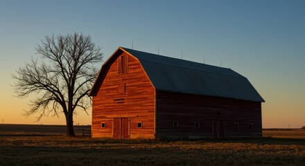 Rural Landscape Barn at Sunset with Tree Silhouette and Golden Hour Lighting Agricultural Scene Countryside Serenity Pastoral Charm