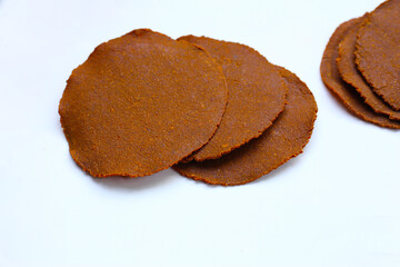 Fermented soybean discs, known as “Thua Nao,” a traditional Thai seasoning used to enhance flavor in Northern cuisine.