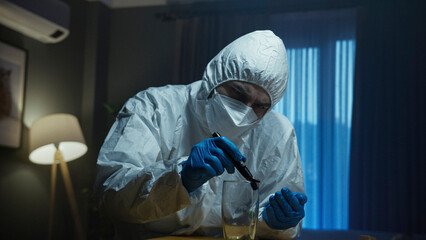 A forensic investigators at a crime scene, in white hazmat suits and blue gloves, carefully examine evidence. Closely inspects a glass.