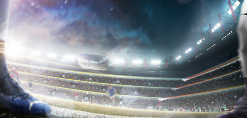 Professional football stadium. Football players are barely visible. Professional sports background for advertising with lights, fans and flags. Large arena