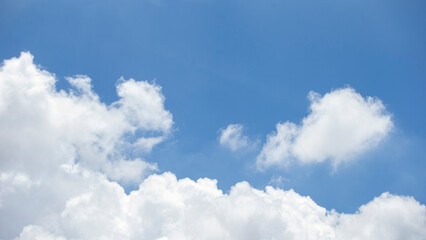 Blue sky with white clouds used as a background.