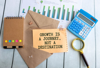 Text big journeys begin with small steps on note paper