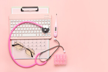 Composition with medical supplies, keyboard and calendar on pink background