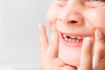 Close-up of Baby's First Teeth Coming Through Gums