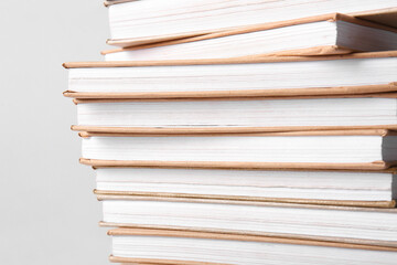 Stack of books on grey background, closeup