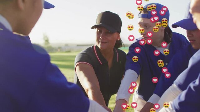 Coach signaling huddling team in ballfield chanting heart-smile emojis cascading around teen player