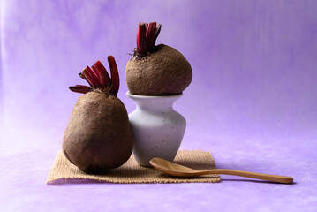 Fresh beetroot on purple background, Imperfectly shape