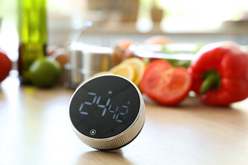 Modern kitchen timer on table in room, closeup