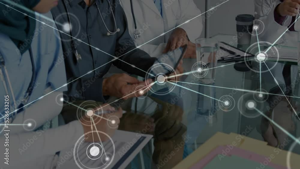 Aufkleber medical team jotting notes, picking up tablet and activating network nodes on table for analysis