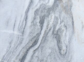 gray and white marble surface features smooth texture with intricate veining, perfect for use in modern interiors, countertops, or artistic backgrounds, enhancing any space aesthetics. close up.