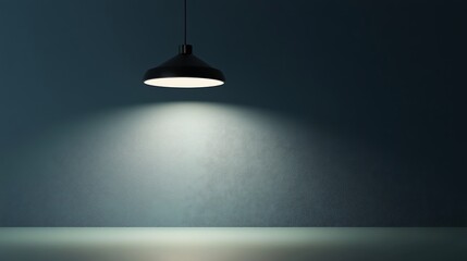 Empty room with a single pendant light.