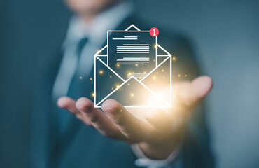hand shows open mail newsletter notification. concept of correspondence, and news for campaign...