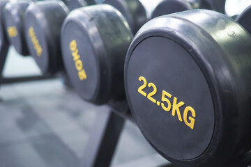 Focus on weights in a modern gym setting during exercise